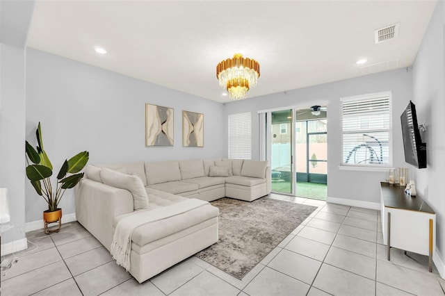 2599 Nouveau Way, Kissimmee, FL 34741 - living room with visible vents, recessed lighting, an inviting chandelier, light tile patterned floors, and baseboards