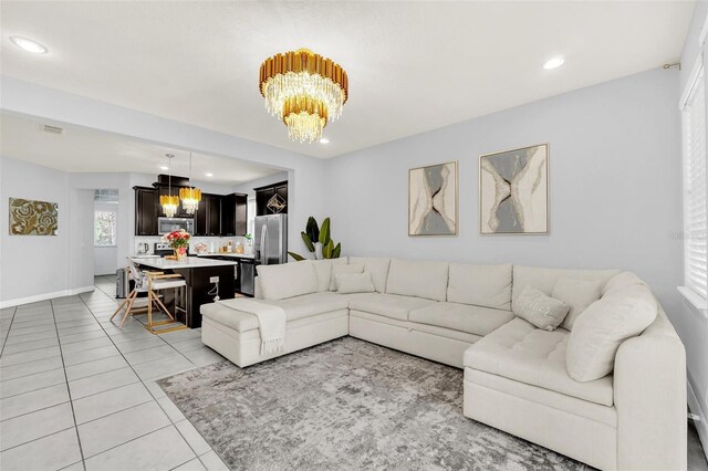 tiled living room with a chandelier