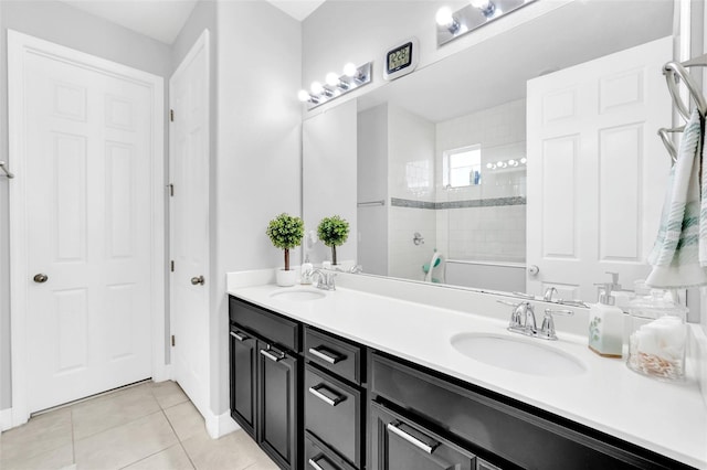 2599 Nouveau Way, Kissimmee, FL 34741 - bathroom featuring tile patterned floors, a walk in shower, double vanity, and a sink