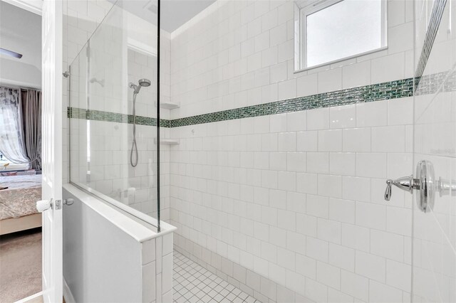 bathroom with a tile shower