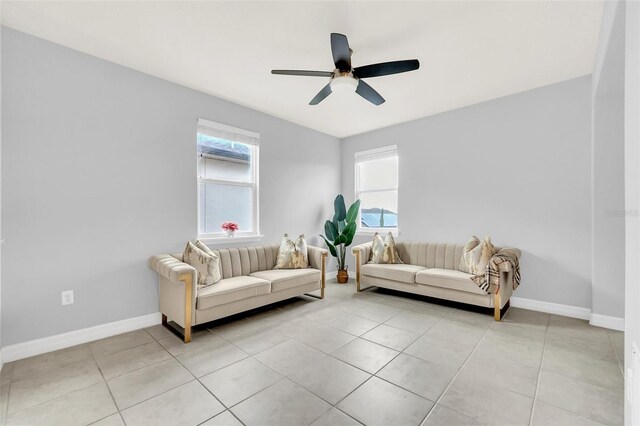 interior space with light tile patterned floors and ceiling fan