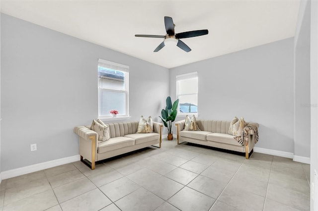 2599 Nouveau Way, Kissimmee, FL 34741 - living room with light tile patterned flooring, baseboards, and a ceiling fan