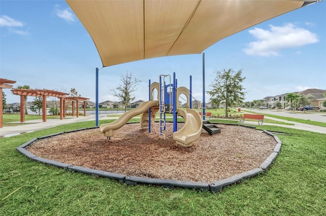 2599 Nouveau Way, Kissimmee, FL 34741 - communal playground featuring a yard and a pergola