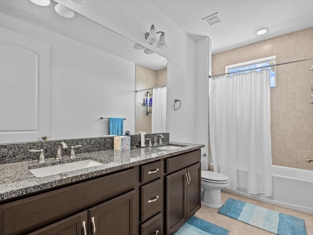 full bathroom featuring toilet, tile patterned flooring, vanity, a textured ceiling, and shower / bathtub combination with curtain