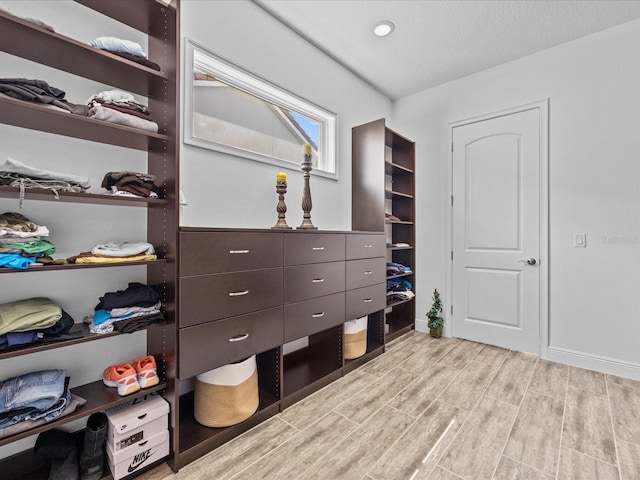 walk in closet featuring light hardwood / wood-style floors