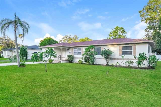 ranch-style house with a front yard