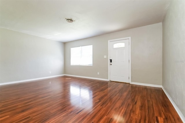 entryway with dark hardwood / wood-style flooring