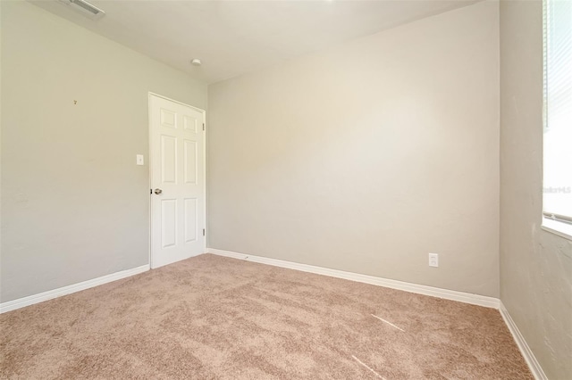 spare room featuring carpet