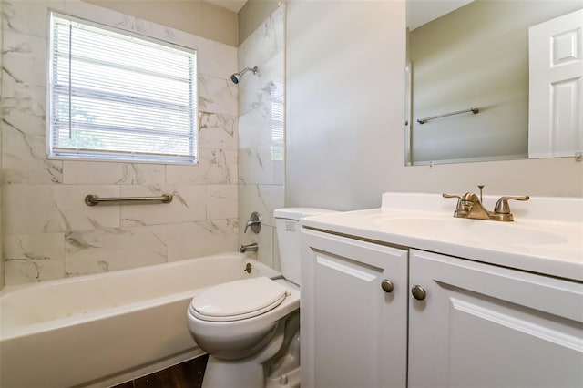 full bathroom featuring tiled shower / bath combo, vanity, toilet, and hardwood / wood-style flooring