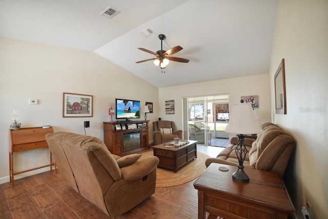 living room with wood-type flooring, vaulted ceiling, and ceiling fan