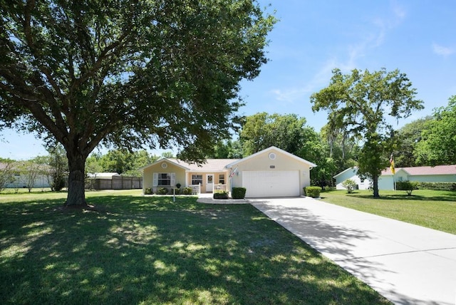 single story home with a front yard and a garage