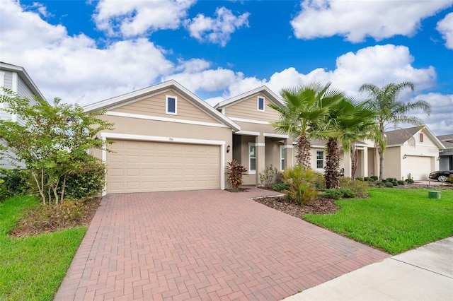 view of front of home featuring a garage and a front yard