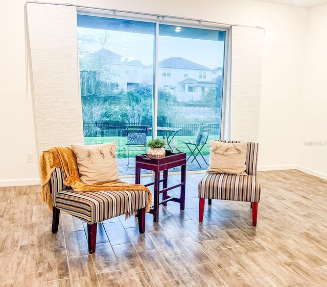 sitting room with hardwood / wood-style floors