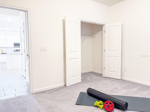 interior space featuring light colored carpet