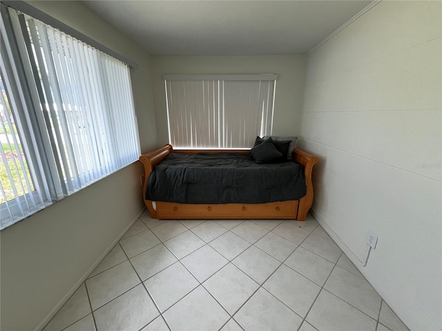 tiled bedroom with crown molding