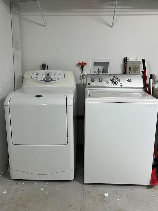 laundry area with washing machine and clothes dryer