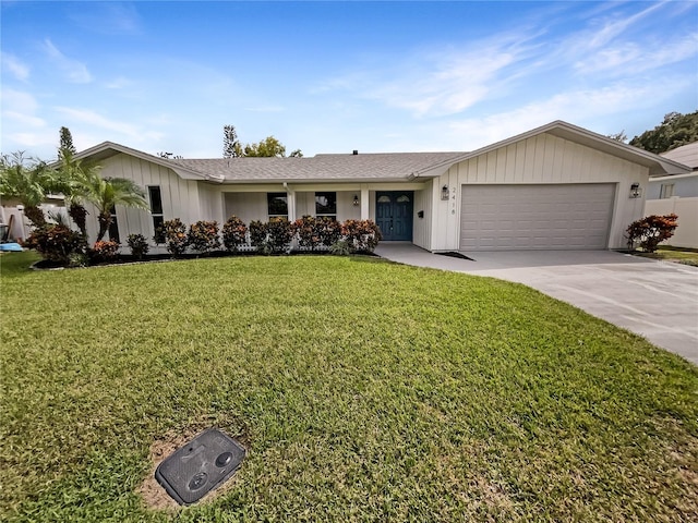 ranch-style house featuring a garage and a front yard