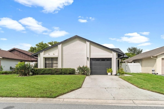 view of front of home featuring a garage and a front yard