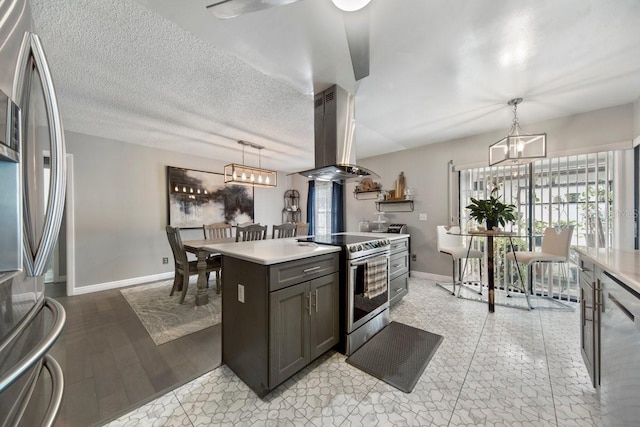 kitchen with a kitchen island, hanging light fixtures, island exhaust hood, and appliances with stainless steel finishes