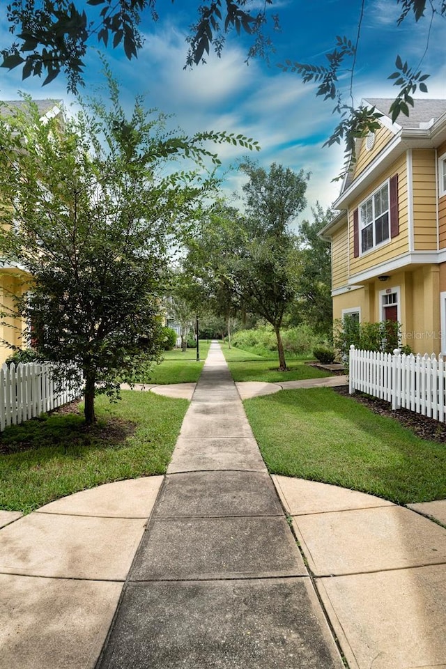 view of community featuring a yard