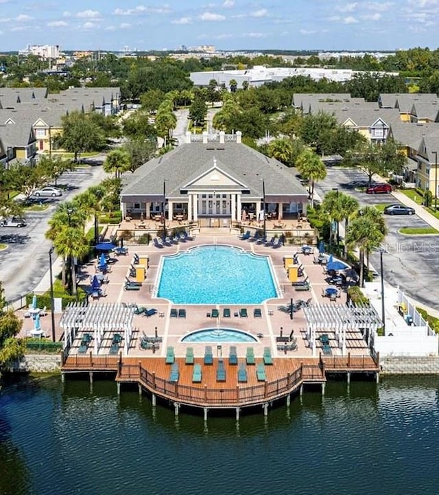 birds eye view of property with a water view