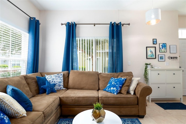 living room with a healthy amount of sunlight and light tile patterned flooring