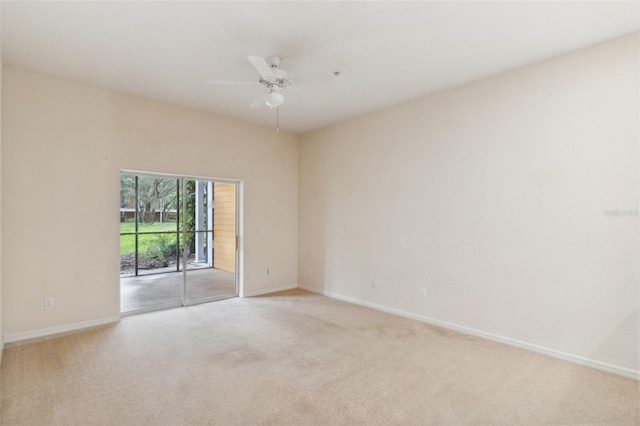 unfurnished room featuring ceiling fan and light colored carpet