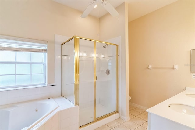 full bathroom featuring vanity, independent shower and bath, ceiling fan, toilet, and tile patterned floors