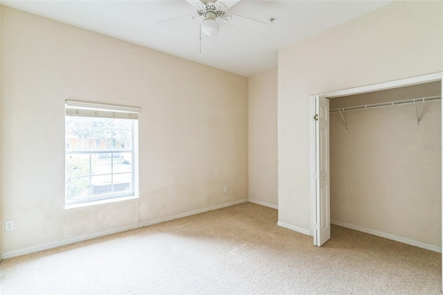 unfurnished bedroom featuring carpet flooring, ceiling fan, and a closet