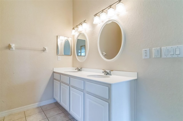 bathroom with tile patterned flooring and vanity