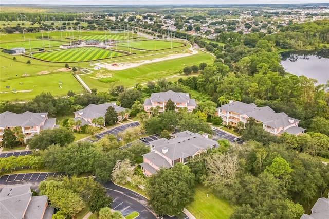 birds eye view of property with a water view