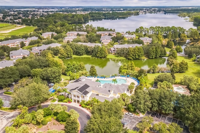 birds eye view of property with a water view