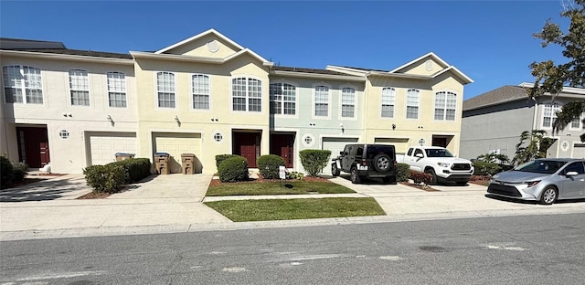 multi unit property featuring a garage