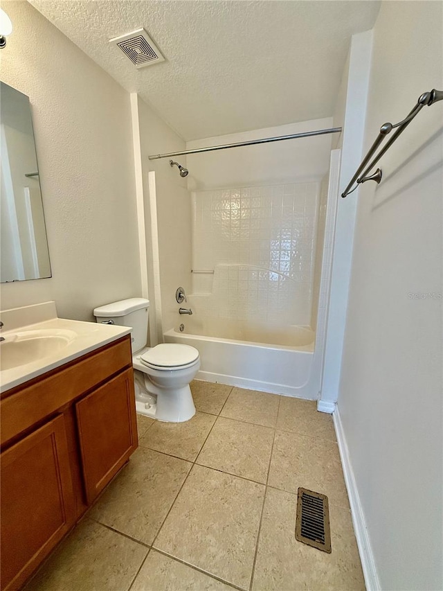 full bathroom featuring a textured ceiling, toilet, vanity, tile patterned flooring, and shower / bathtub combination