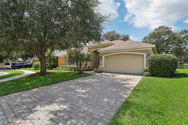 view of front of home with a front yard and a garage