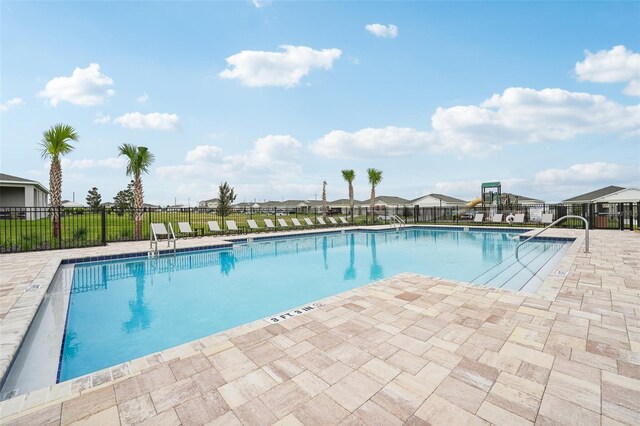 view of swimming pool with a patio area