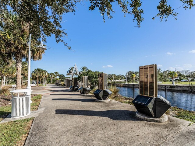 surrounding community with a water view