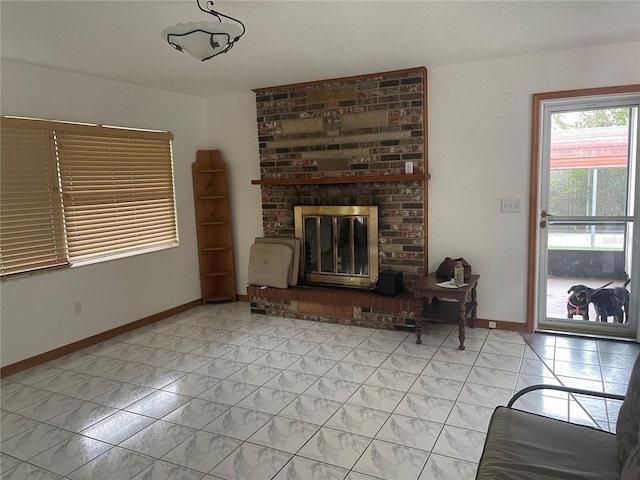 unfurnished living room with a brick fireplace