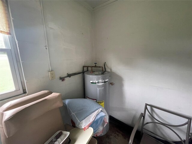 utility room featuring water heater