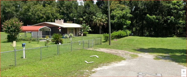 view of property's community with a lawn