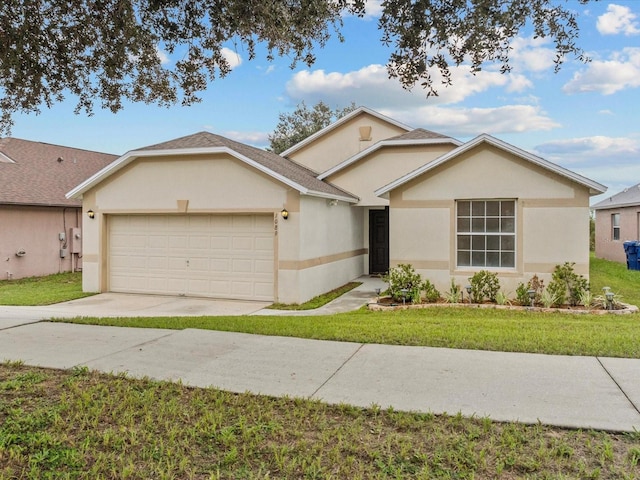 ranch-style house with a garage and a front lawn