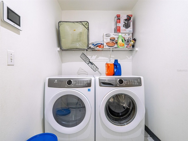 laundry room with separate washer and dryer