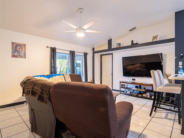 tiled living room with lofted ceiling and ceiling fan