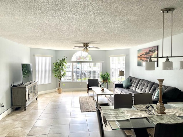 tiled living room featuring ceiling fan