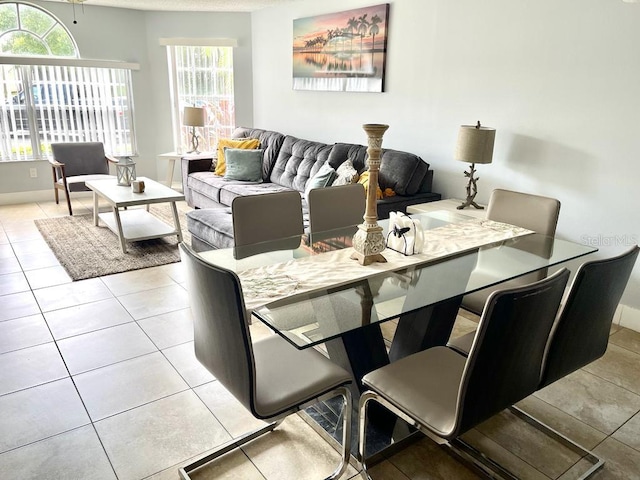 dining space with light tile patterned flooring