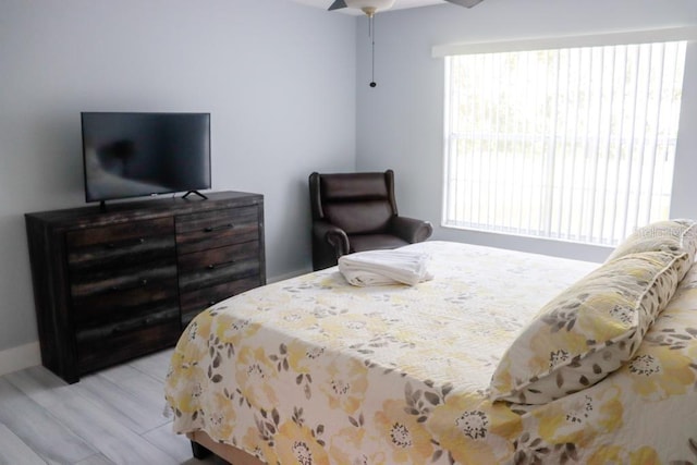 bedroom featuring light hardwood / wood-style flooring and ceiling fan