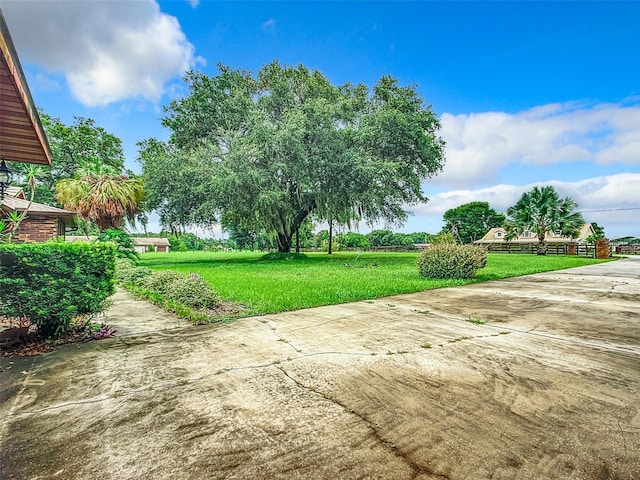 exterior space with a lawn and a patio area