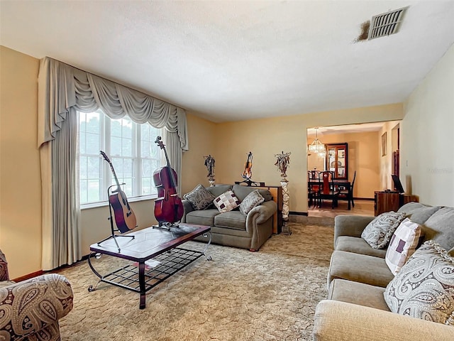 carpeted living room with a textured ceiling