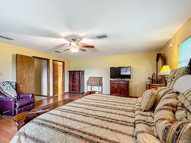 bedroom with ceiling fan and wood-type flooring