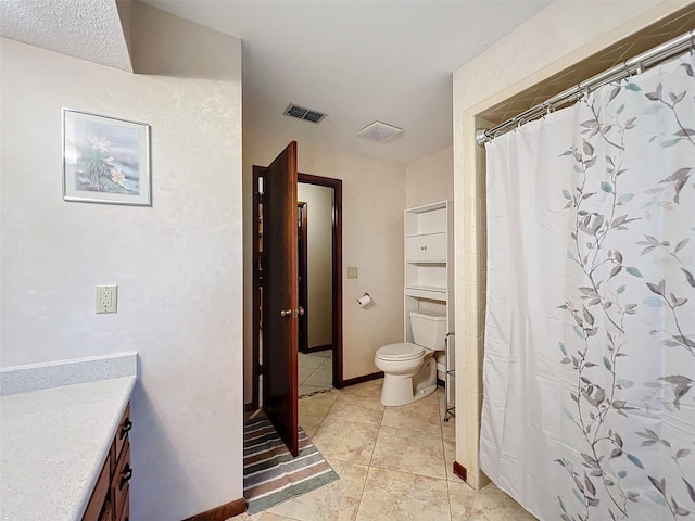 bathroom with a shower with shower curtain, vanity, toilet, and tile patterned flooring